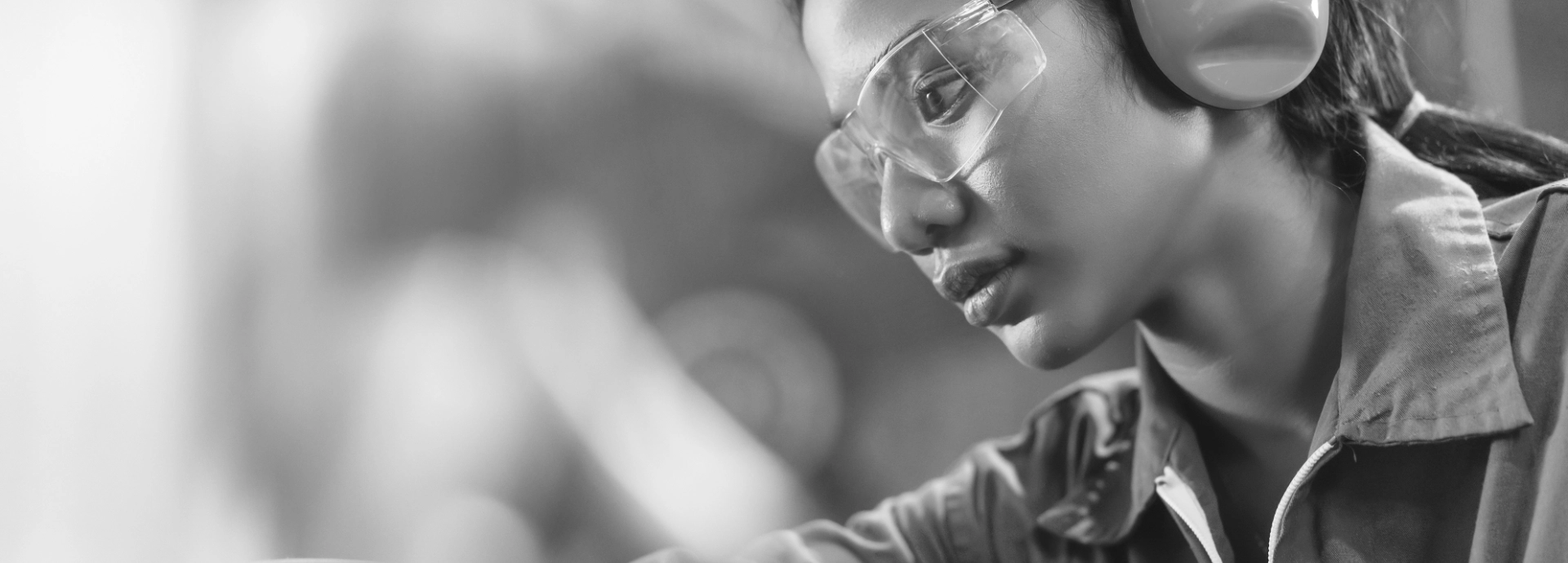Background 1 Image of a woman wearing eye and ear protection