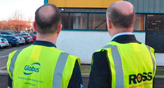 Image of two men wearing high visibility jackets